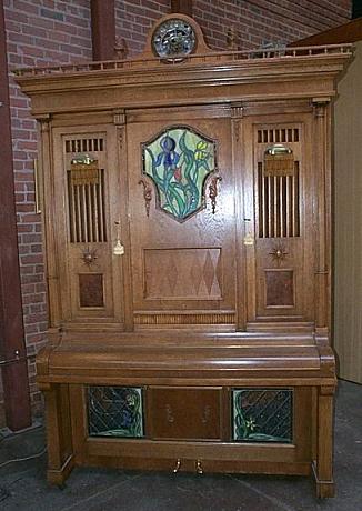 The Imhof and Mukle Commandant 2 orchestrion, a large wooden cabinet with visible pipes and percussion instruments