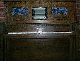 The Wurlitzer Violin Piano, a tall wooden cabinet with visible pipes designed to emulate a violin sound